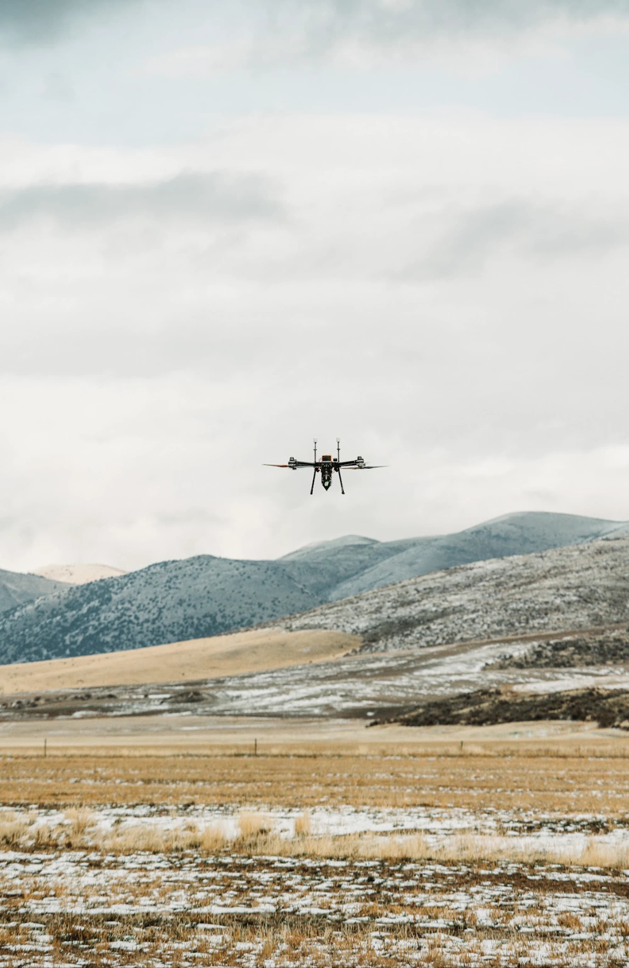 Rainmaker drone flying over open terrain