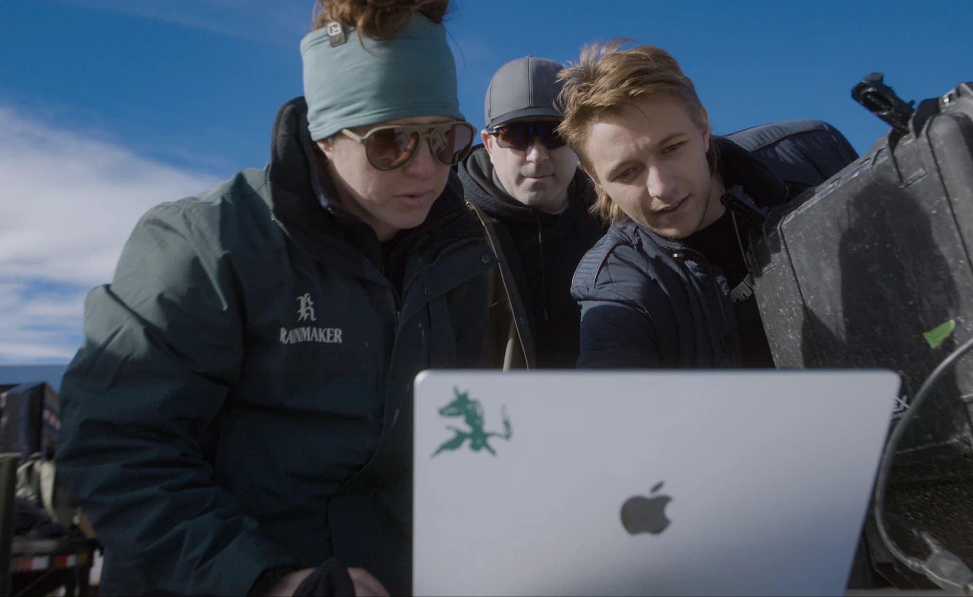 Rainmaker team collaborating on a laptop