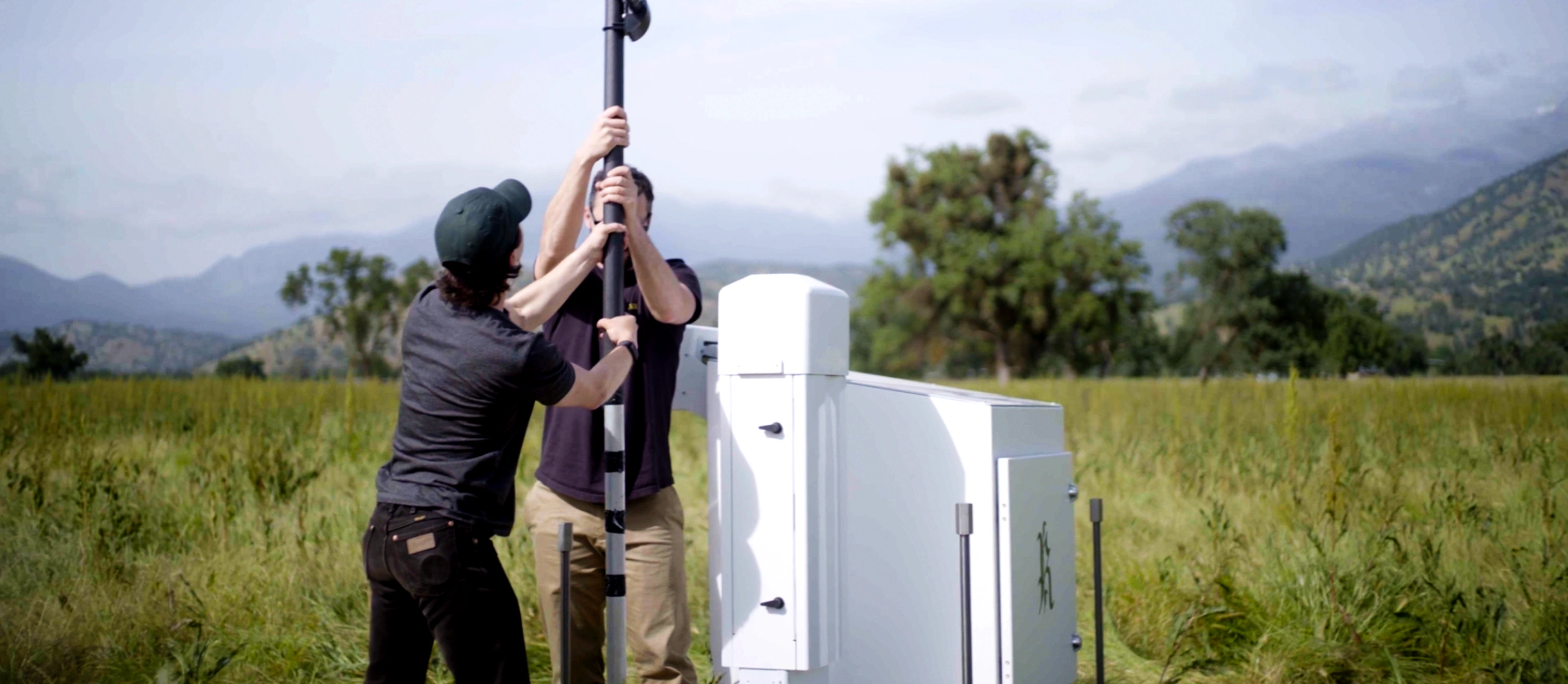 Rainmaker team members setting up equipment in the field